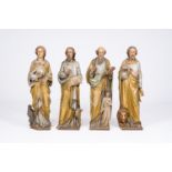 Four large Gothic revival carved, polychromed and gilt limewood 'evangelist' figures, probably Germa