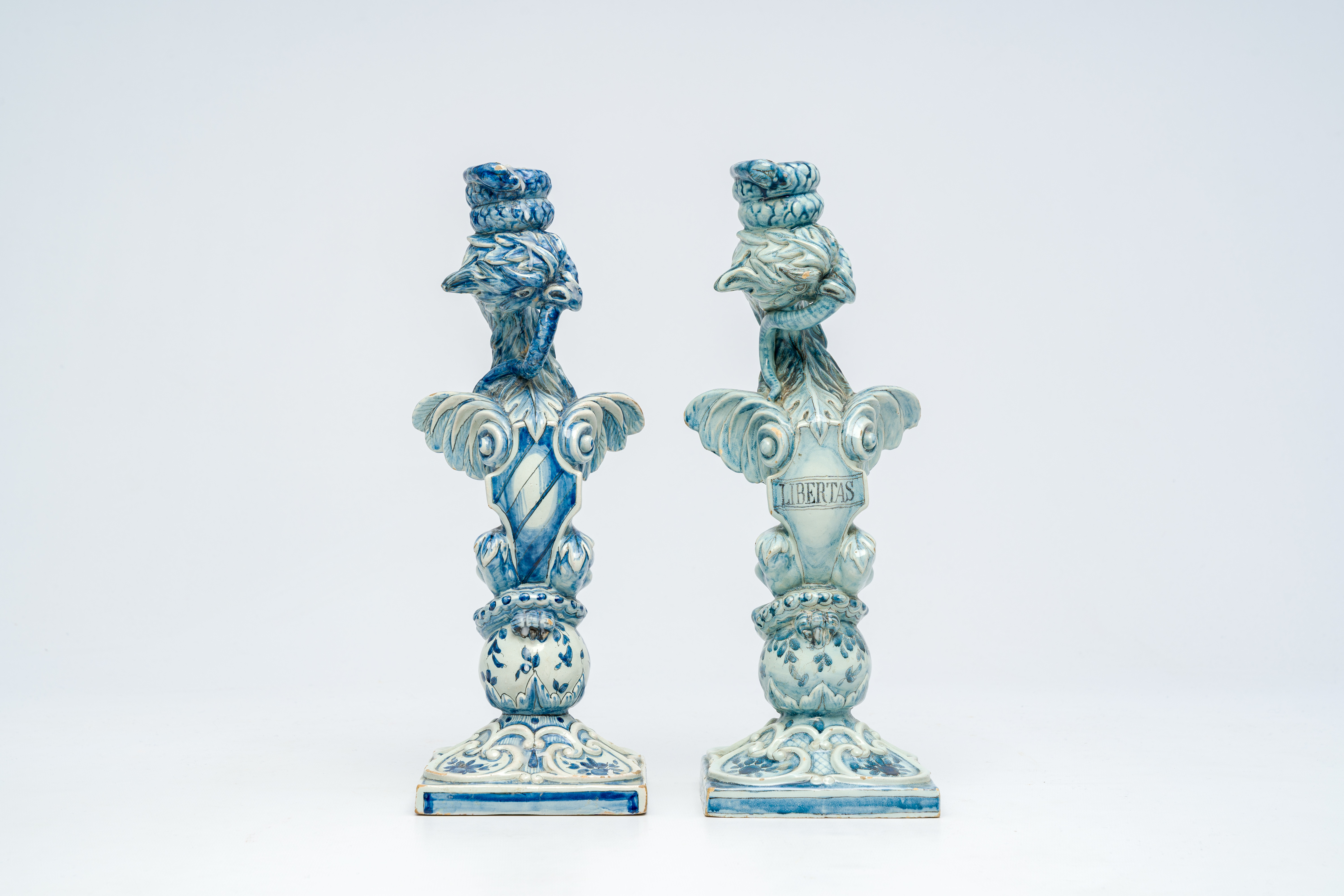 A pair of blue and white Italian pottery 'griffin' candlesticks, Cantagalli, late 19th C. - Image 2 of 7