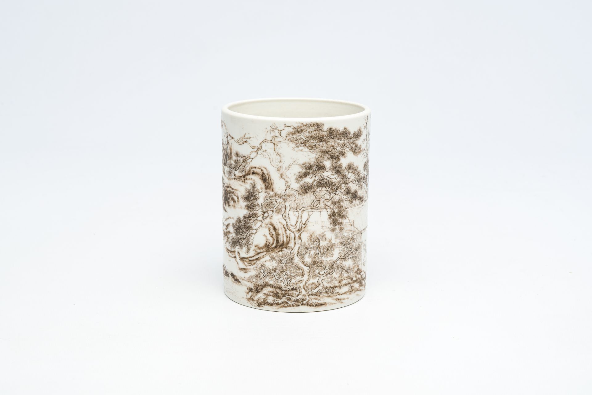 A Chinese grisaille brush pot with an animated landscape, 20th C.