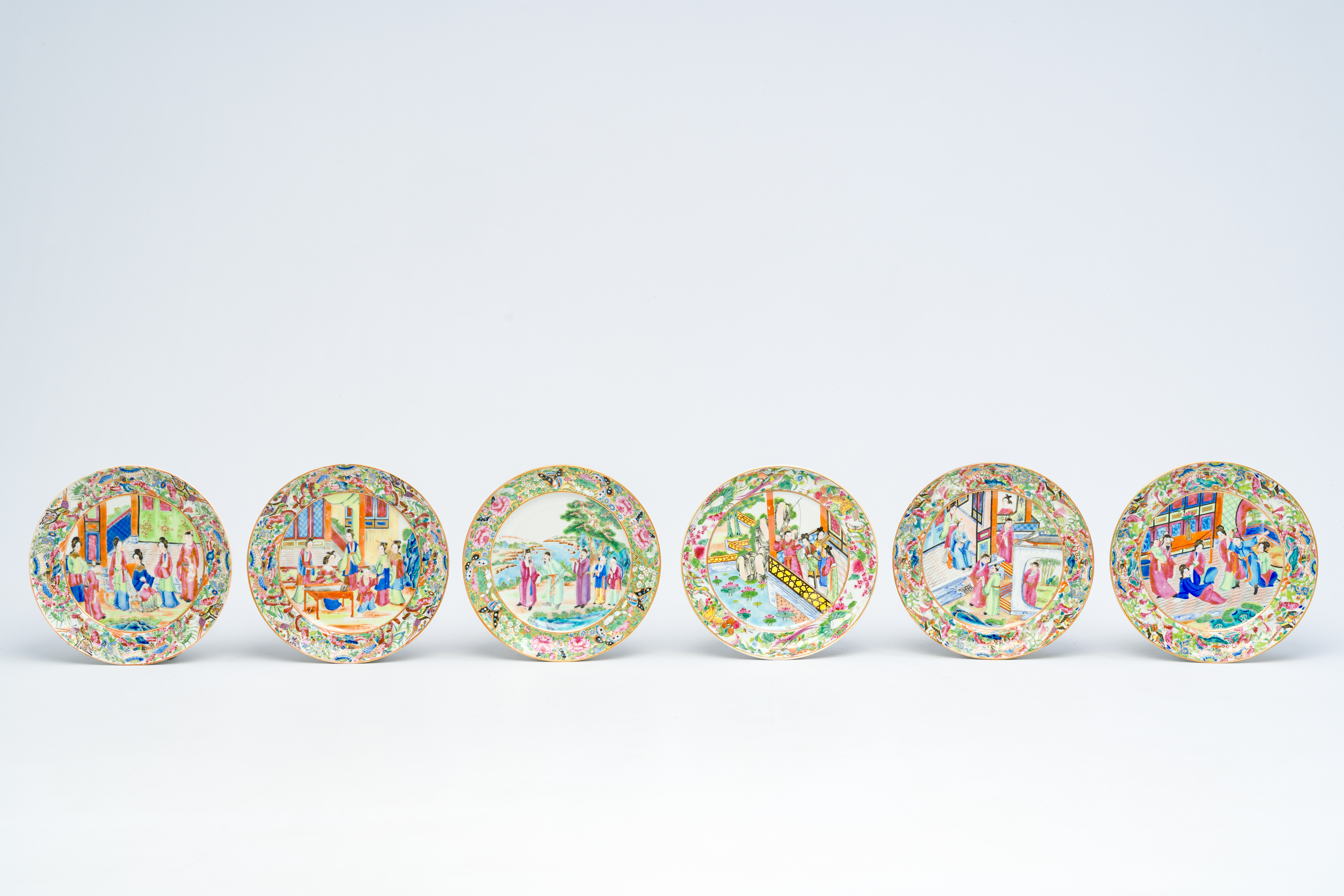 Twelve Chinese Canton famille rose plates with an animated design, 19th C. - Image 2 of 5