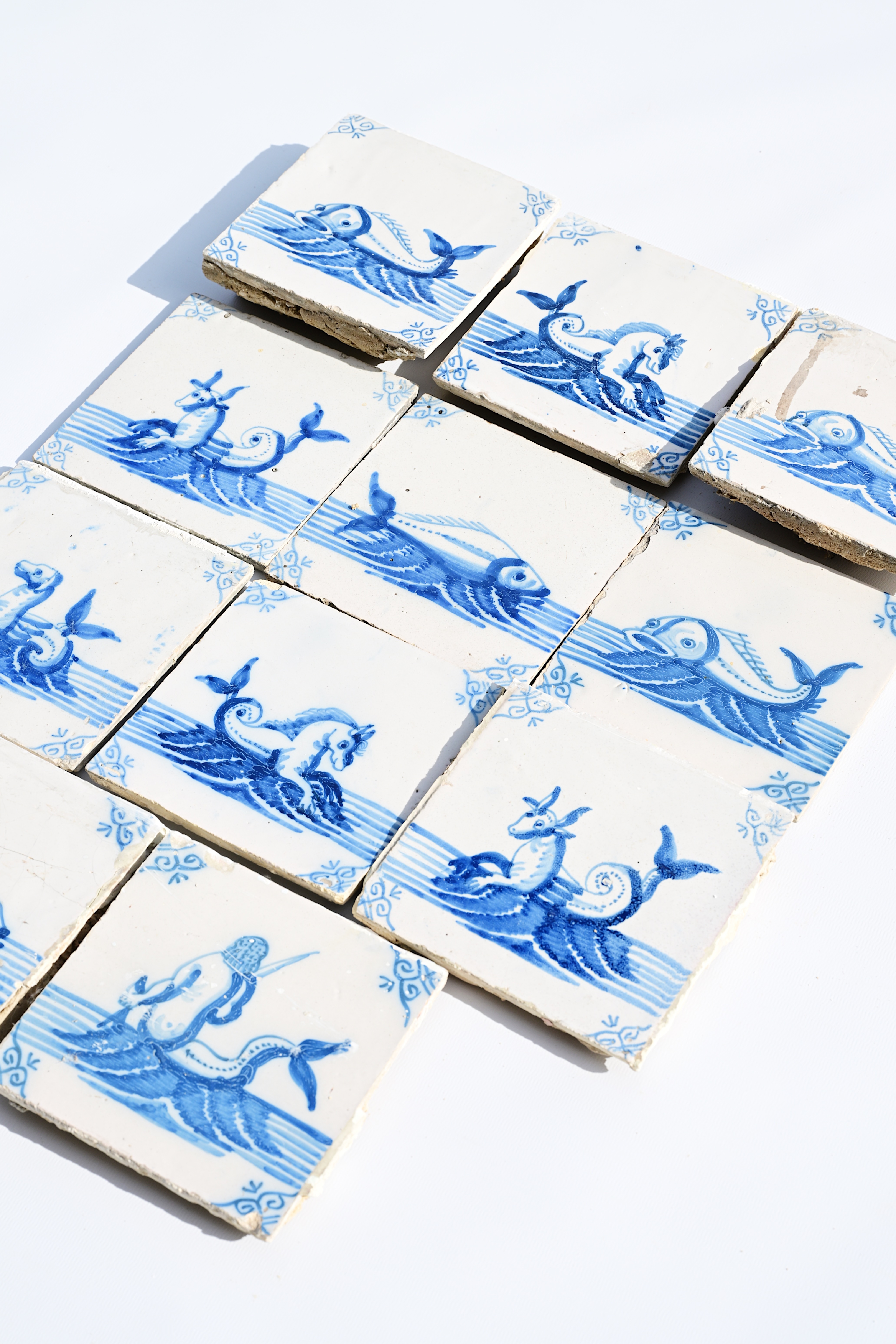 Eleven Dutch Delft blue and white 'sea monster' tiles, 19th C. - Image 3 of 3