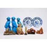 Five Chinese soapstone sculptures, three turquoise glazed lions and a pair of blue and white plates,