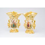 A pair of French gilt and polychrome old Paris porcelain vases with an Indian couple and floral reli