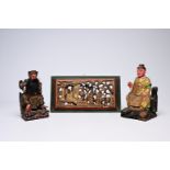 Two Chinese polychromed wood votive figures and a gilt panel, 19th C.