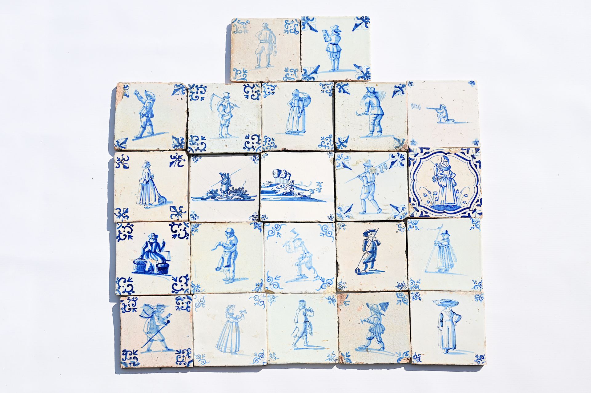 Twenty-two Dutch Delft blue and white 'figure' tiles, 17th/18th C.