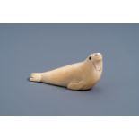 An Inuit carved whale ivory figure of a seal, Canada or Alaska, 19th C.