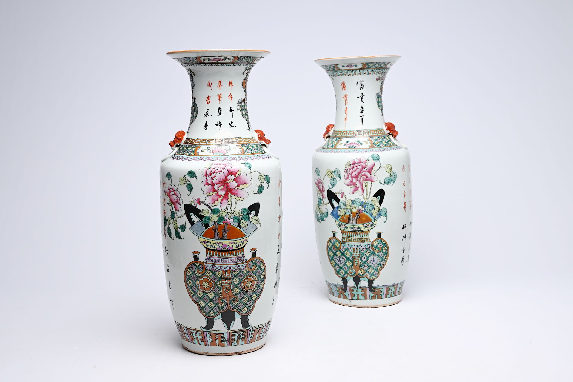 A pair of Chinese famille rose 'flower basket' vases, 19th C.