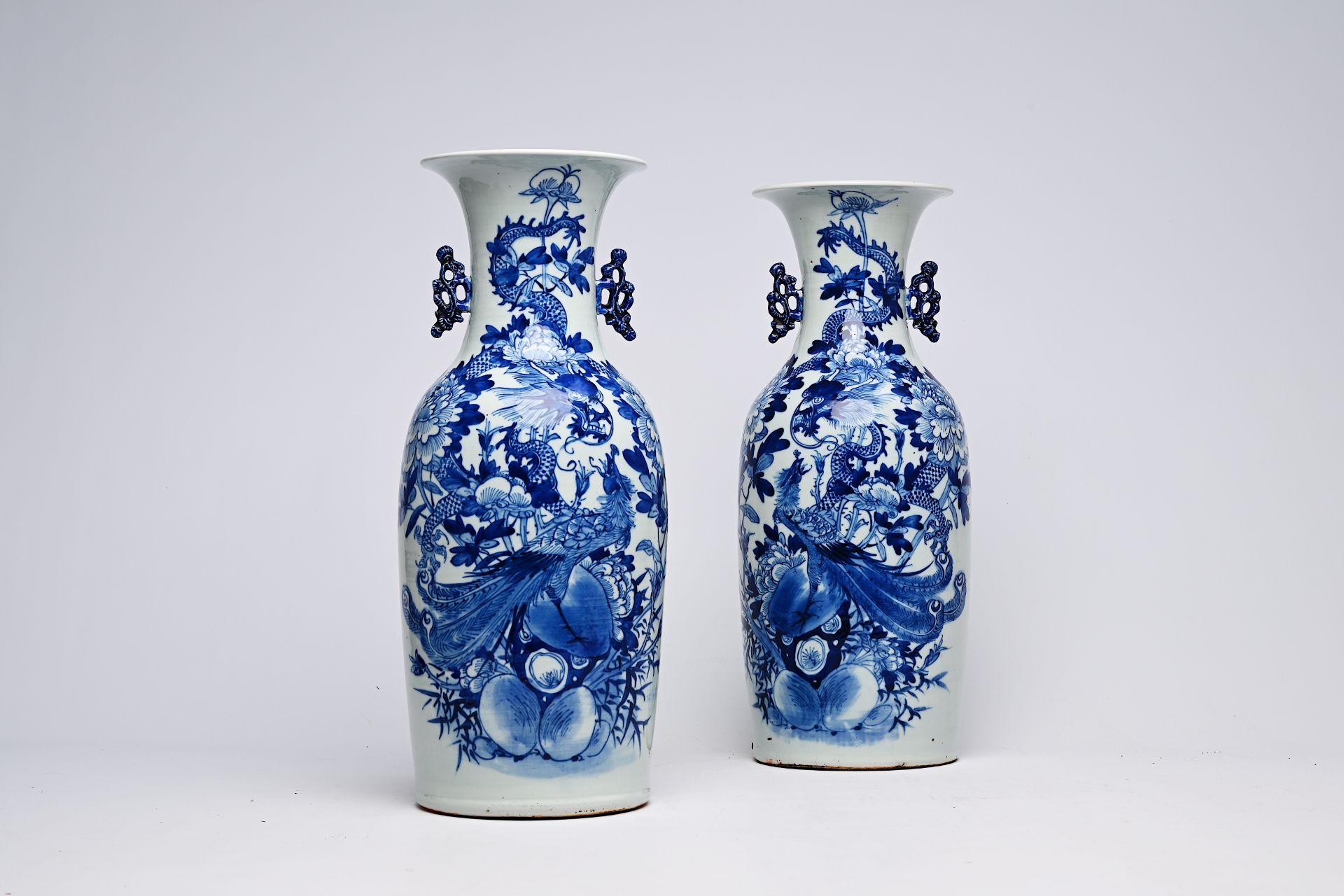A pair of Chinese blue and white celadon ground vases with a dragon and a phoenix among blossoming b - Image 19 of 28