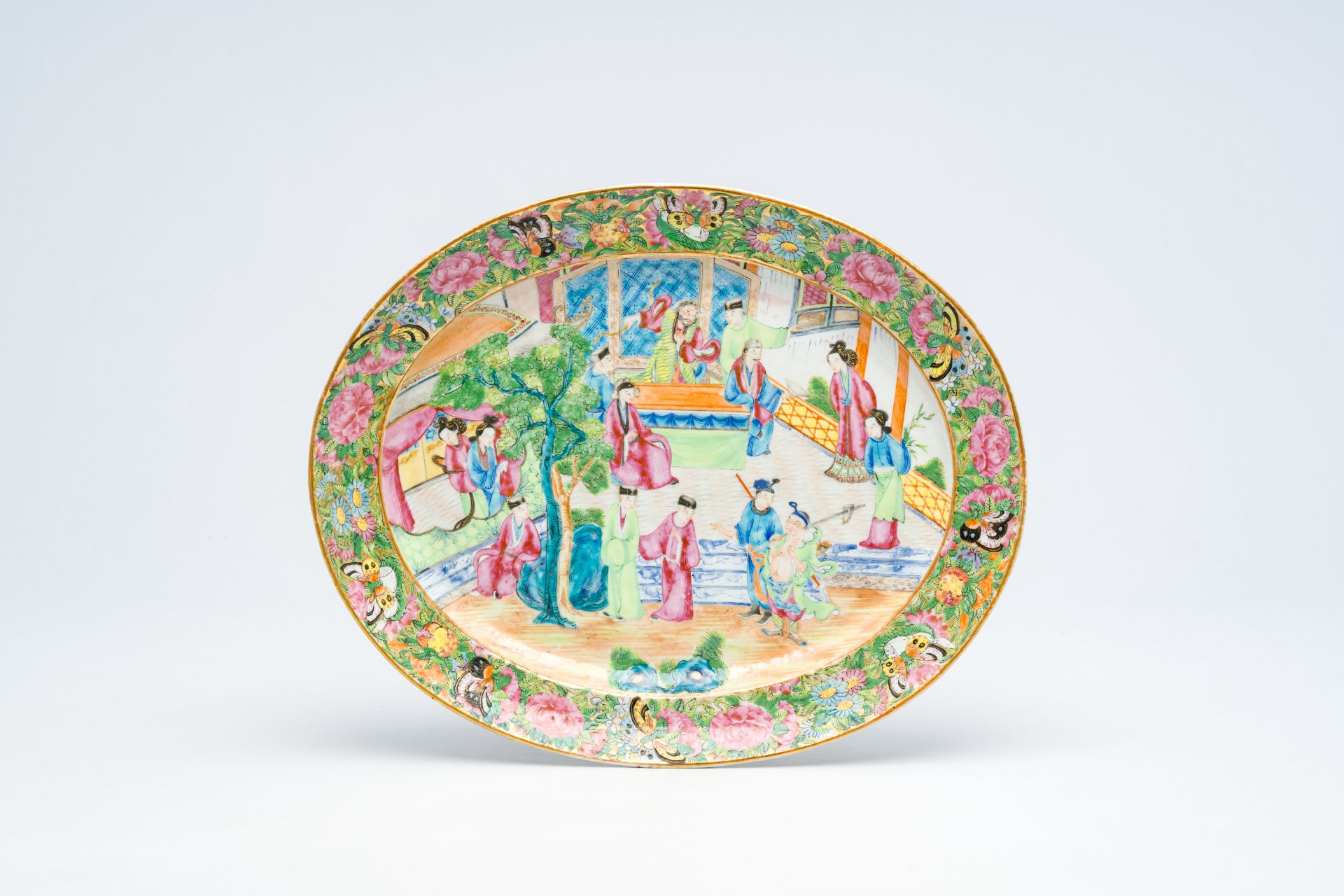 A Chinese Canton famille rose oval 'palace scene' dish, 19th C.
