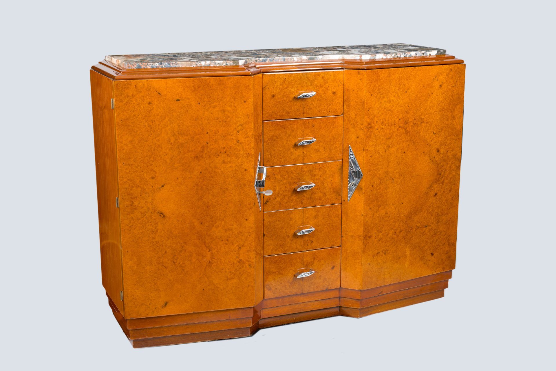 A burl wood veneered Art Deco chest with five drawers and a marble top, first half 20th C.