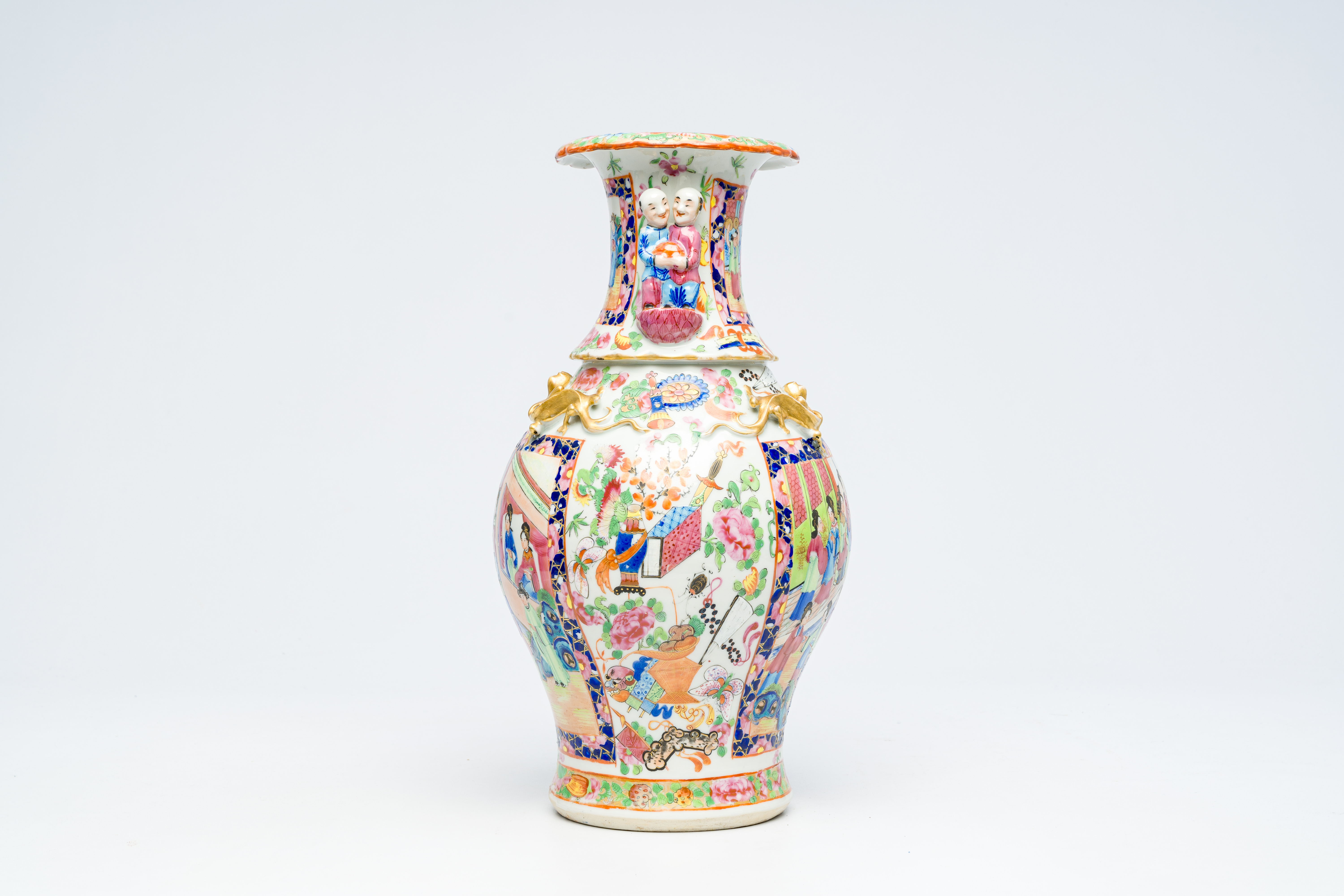 A Chinese Canton famille rose vase with palace scenes and the Hehe Er Xian twins in relief, 19th C. - Image 4 of 6
