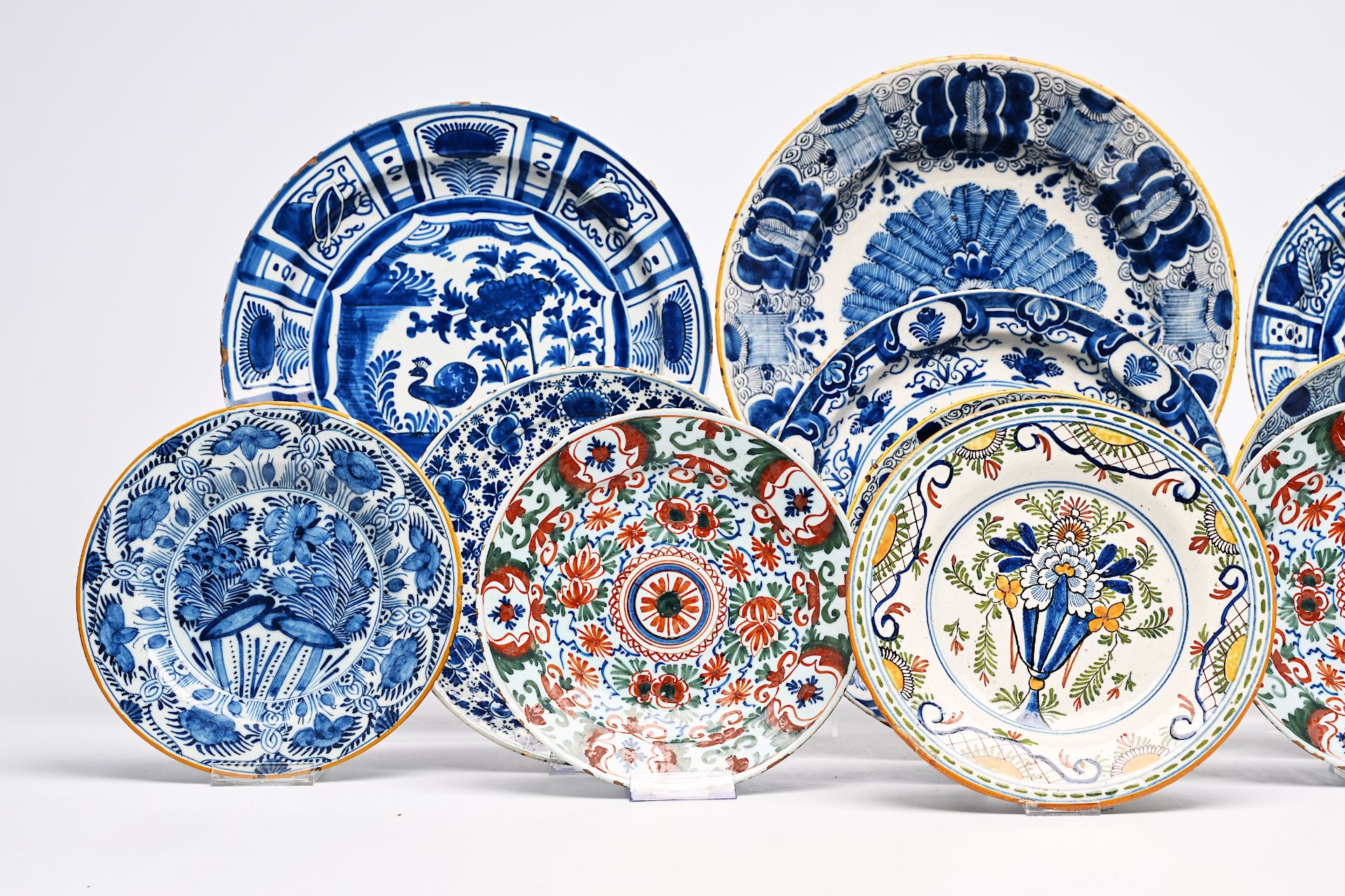 Twelve Dutch Delft blue and white and polychrome plates and dishes, 18th C. - Image 2 of 7