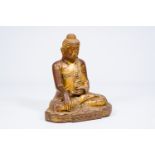 A tall inlaid gilt wood figure of a seated Buddha, Burma or Thailand, 19th/20th C.