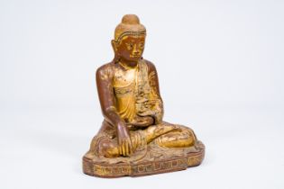 A tall inlaid gilt wood figure of a seated Buddha, Burma or Thailand, 19th/20th C.