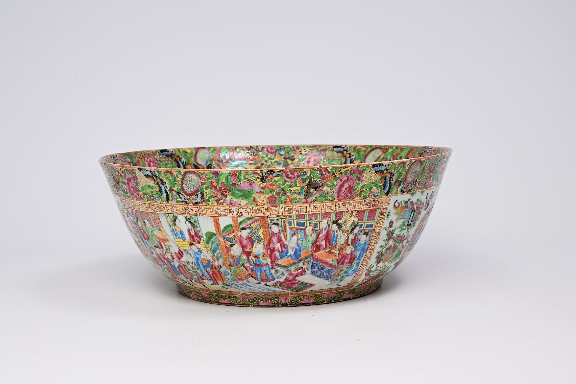 An imposing Chinese Canton famille rose bowl with palace scenes, antiquities and floral design, 19th