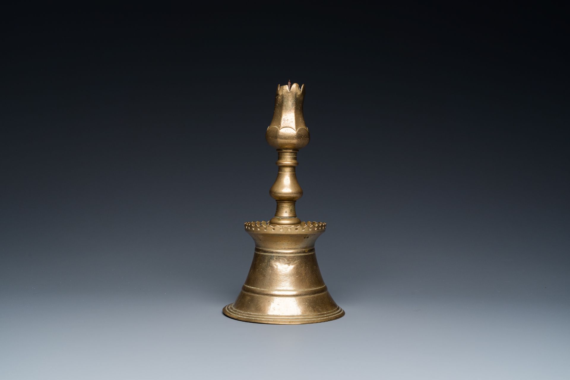 A Turkish bronze candlestick with tulip-shaped sconce, 18th C. - Image 4 of 7