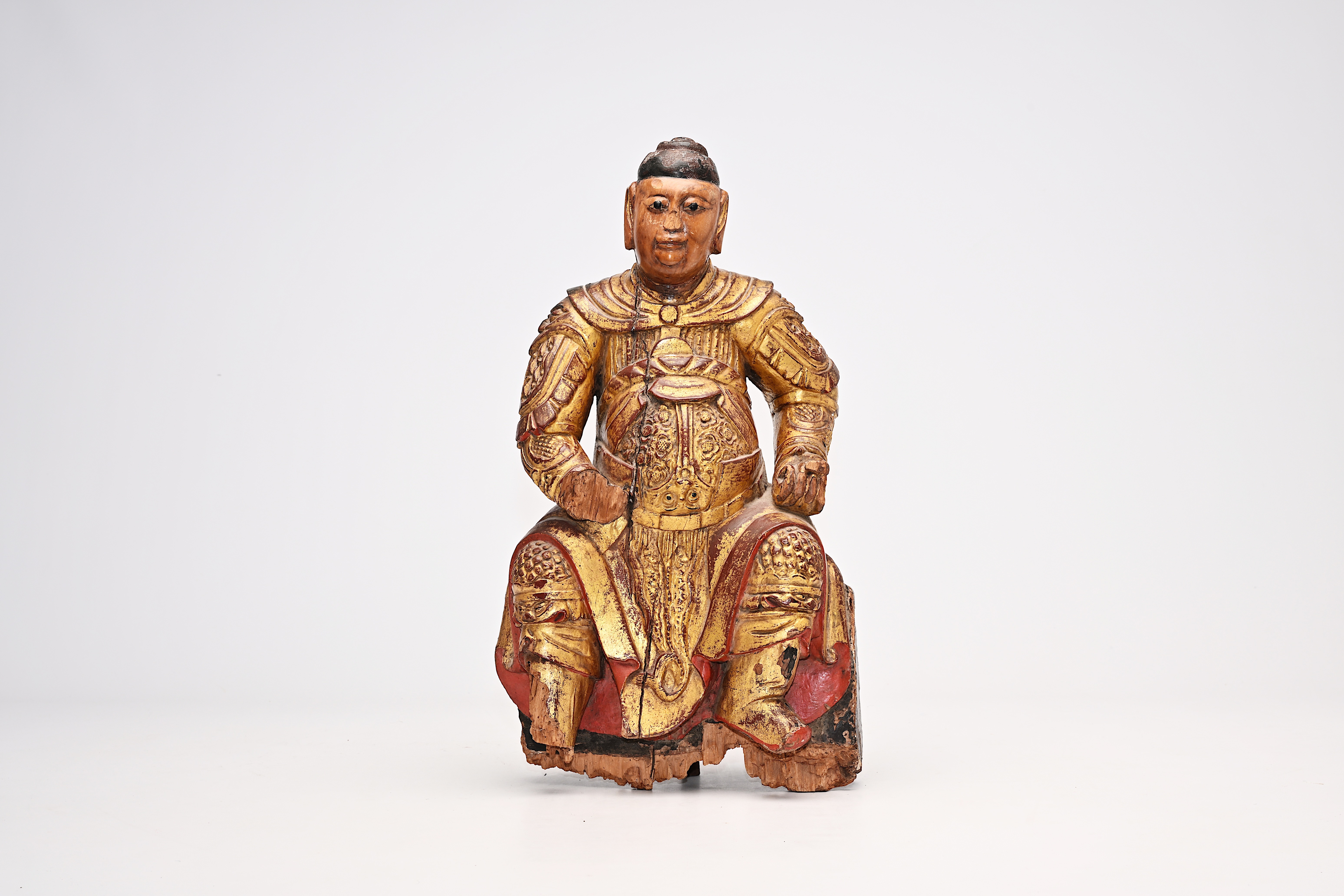 A carved, gilt and polychrome painted wood guardian figure, China, probably 17th C.