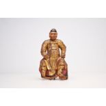 A carved, gilt and polychrome painted wood guardian figure, China, probably 17th C.