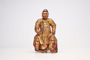 A carved, gilt and polychrome painted wood guardian figure, China, probably 17th C.