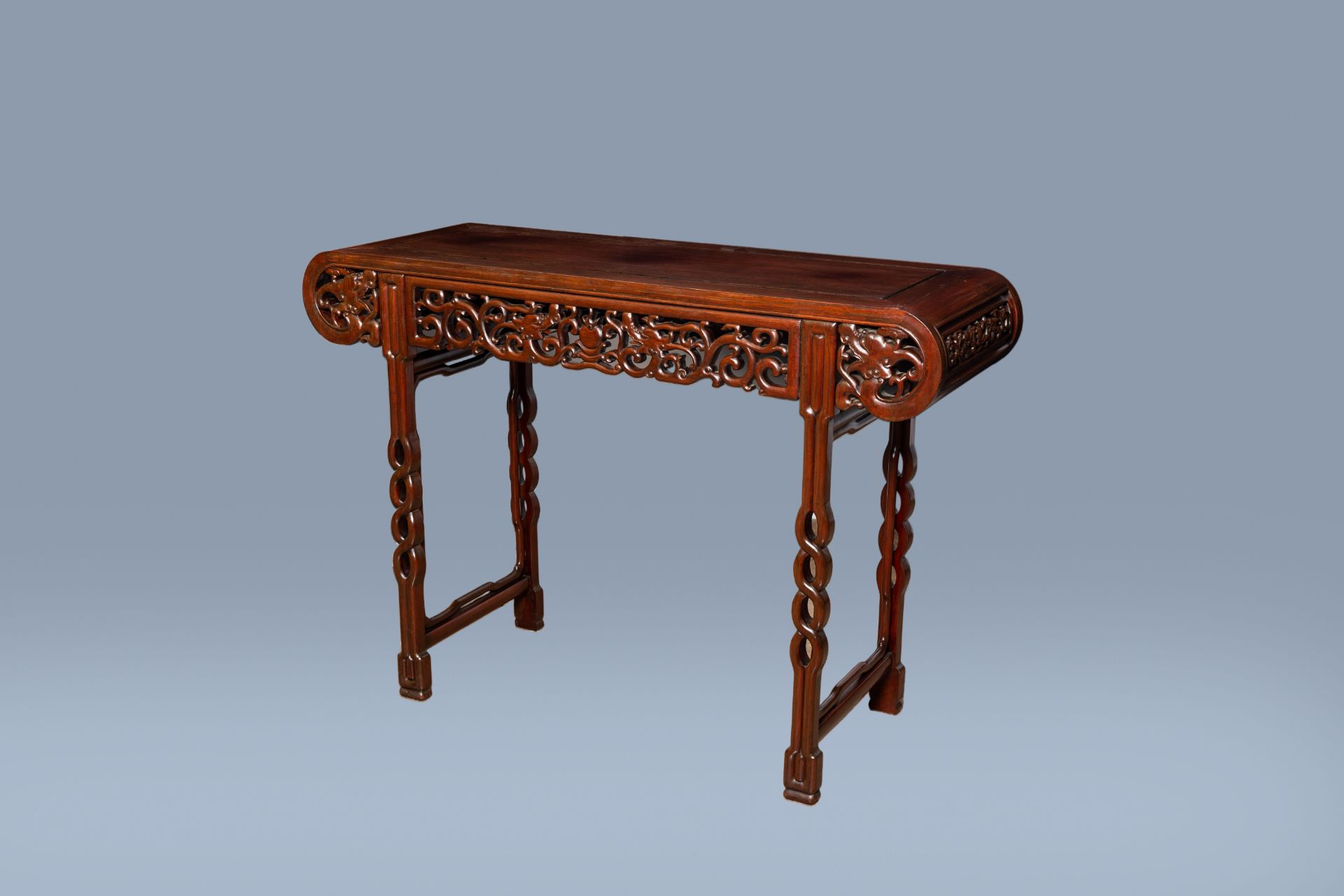 A Chinese carved hardwood 'dragons chasing the pearl' altar table, 20th C.