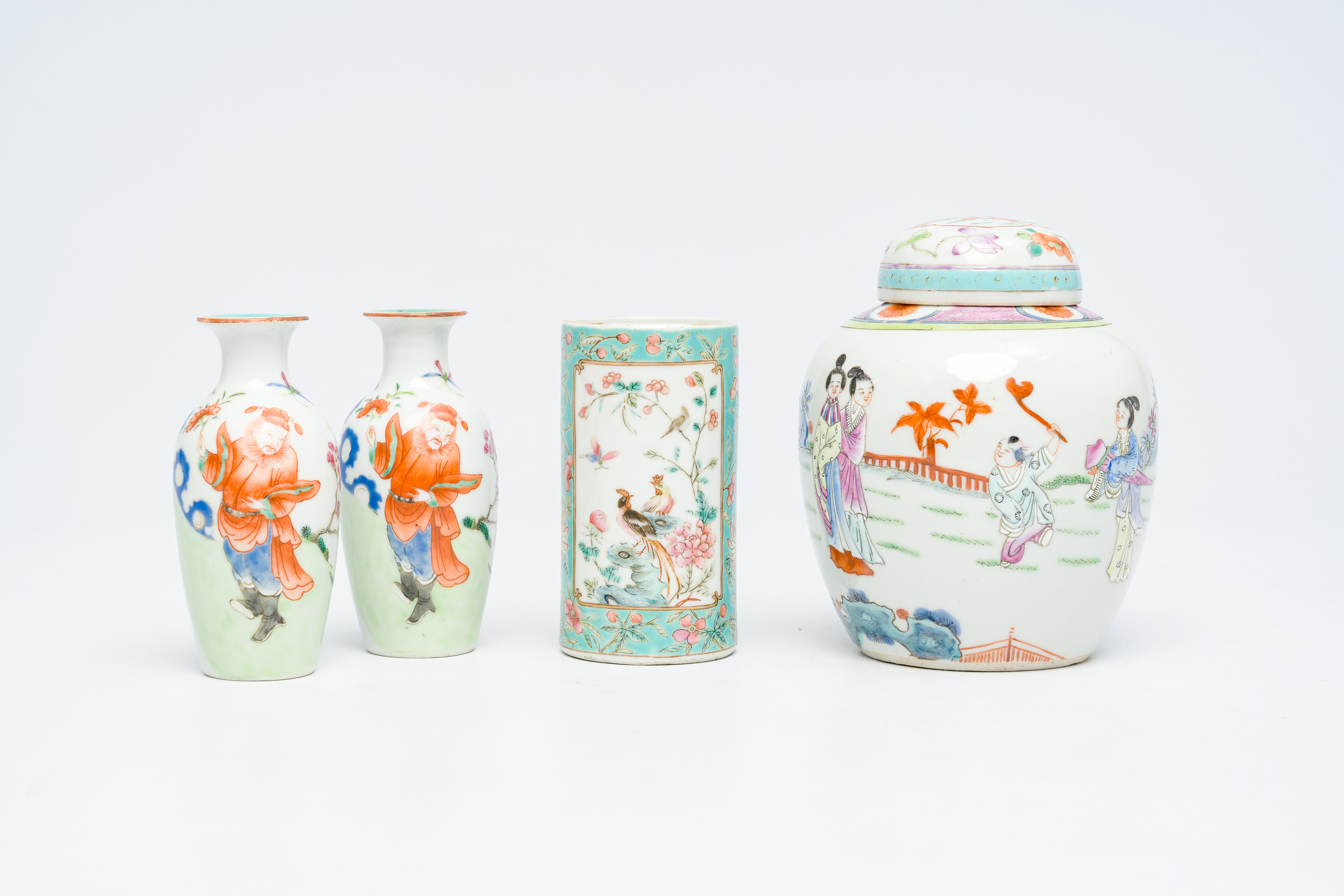 A Chinese famille rose brush pot, a jar and cover with figures in a garden and a pair of 'Immortals'