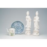 A Chinese famille rose teapot, two blanc de Chine figures of Guanyin and a blue and white dish, 19th