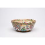 A large Chinese Canton famille rose bowl with floral design and palace scenes, 19th C.