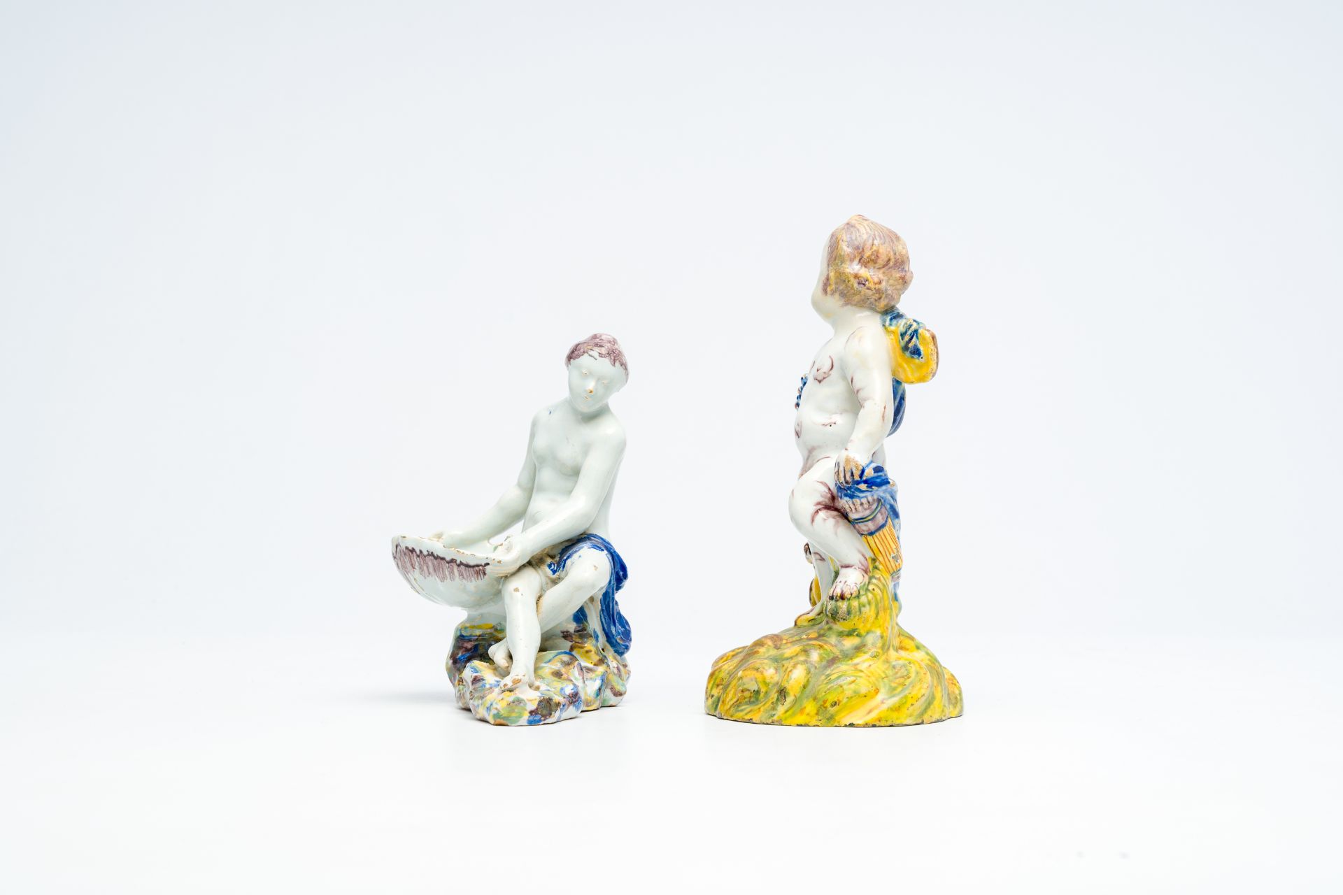 A polychrome 'putto and bird' faience sculpture and a 'lady with a shell' salt cellar, Delft or Brus - Image 5 of 7