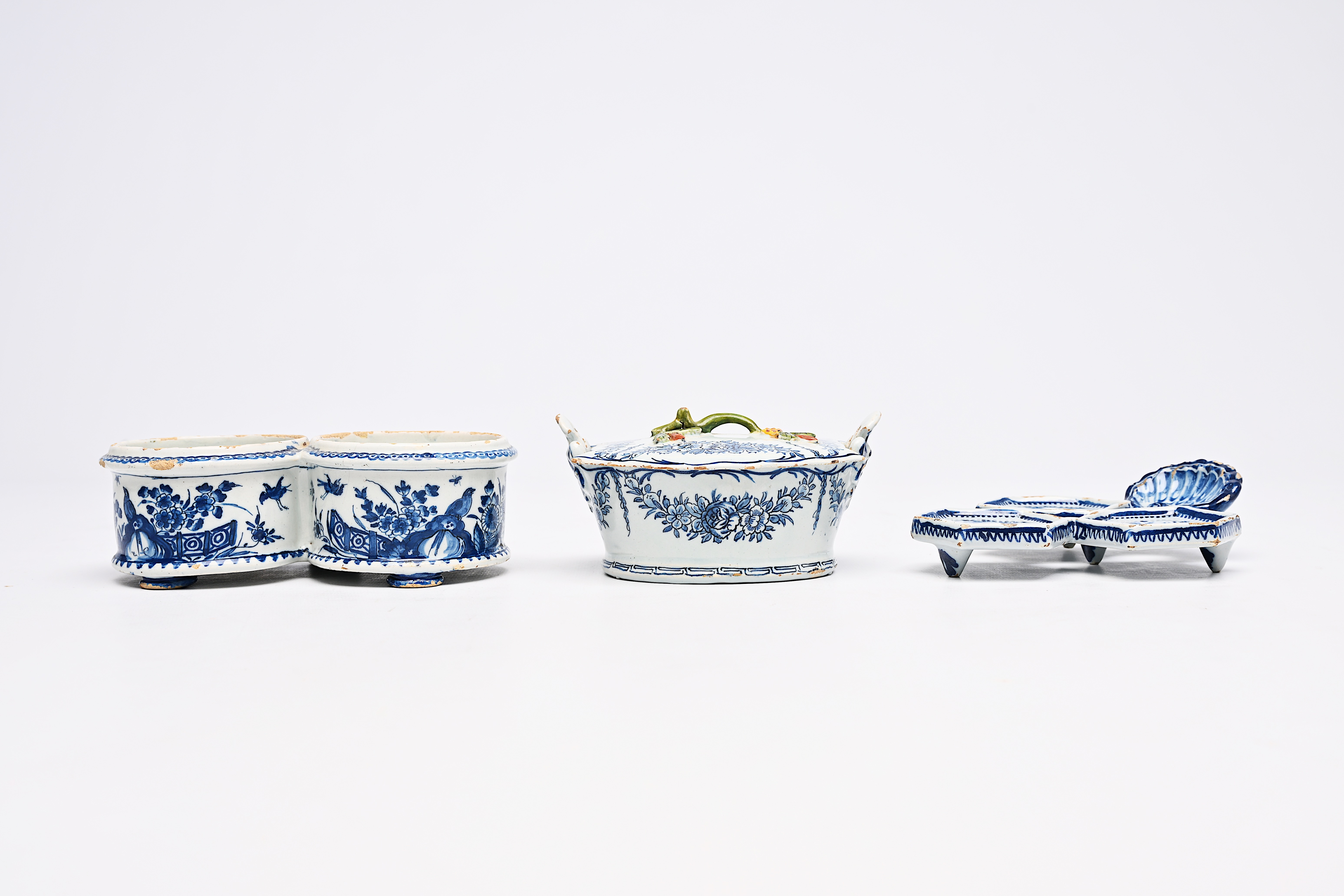 A Dutch Delft blue and white butter tub, an oil and vinegar holder and a spice dish with floral desi - Image 2 of 9