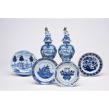 A pair of Dutch Delft blue and white vases and covers with landscapes and four various plates, 18th/