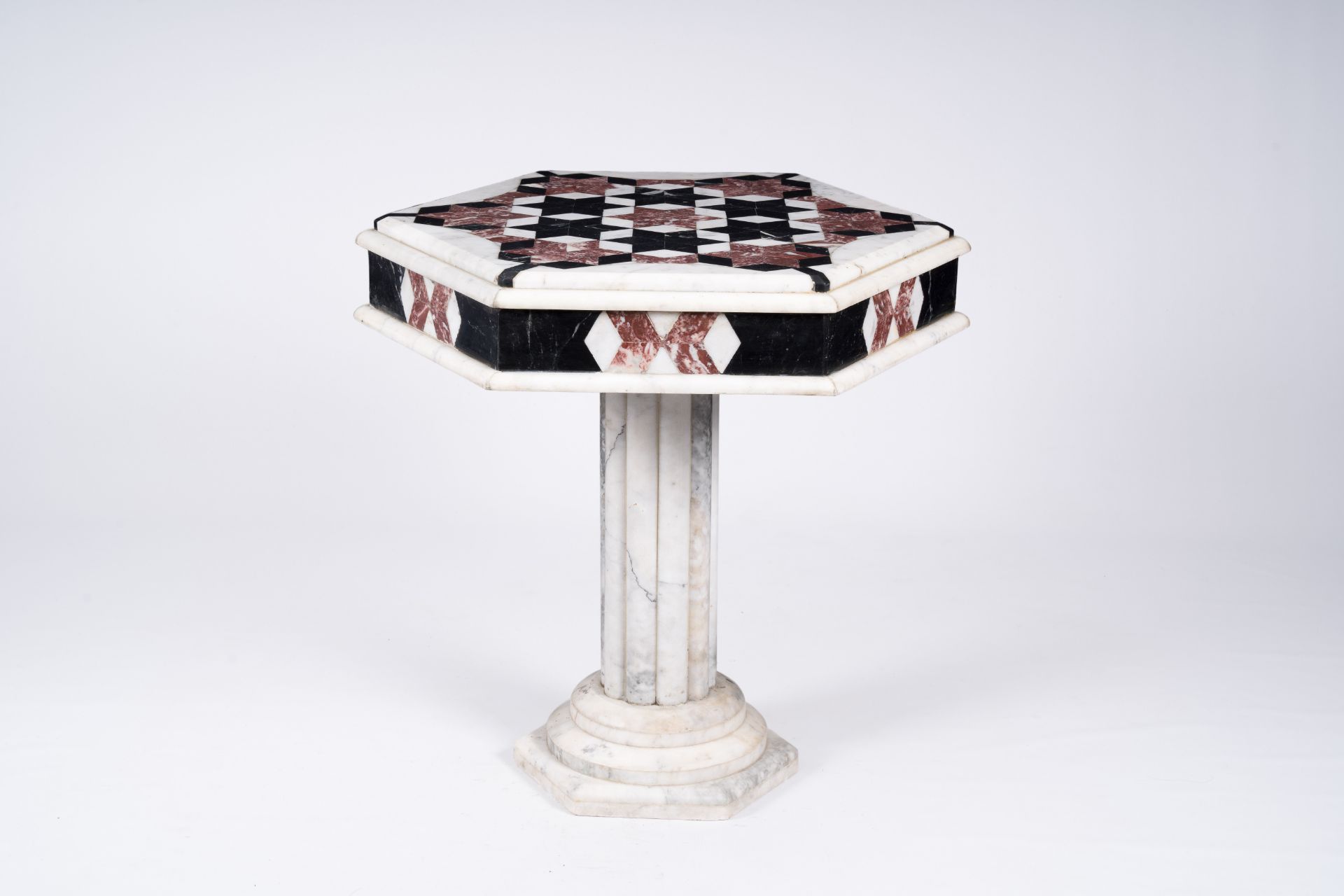 An Italian hexagonal marble side table with geometric design, 20th C.