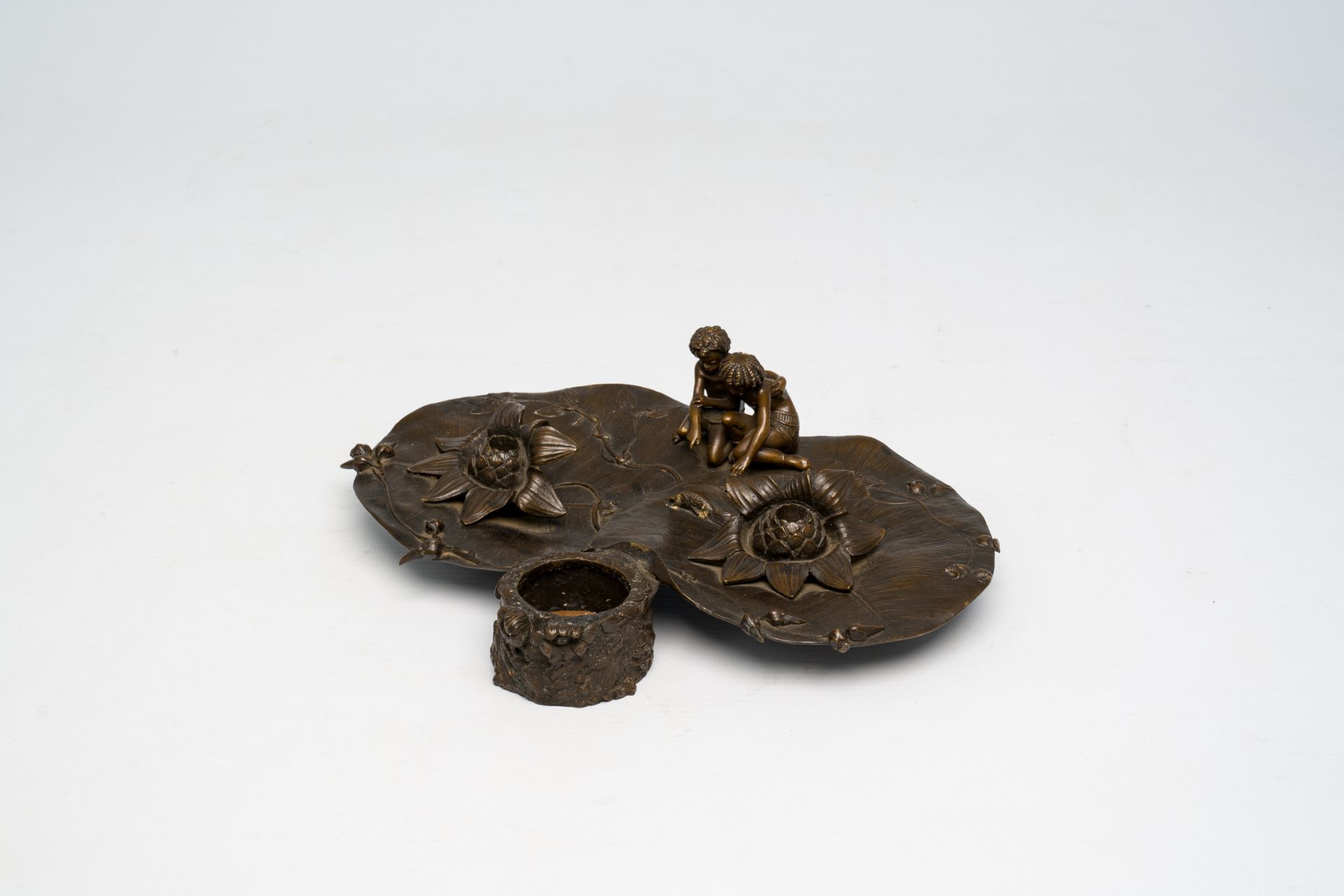 A French bronze Art Nouveau ink well with two children near a pond, ca. 1900