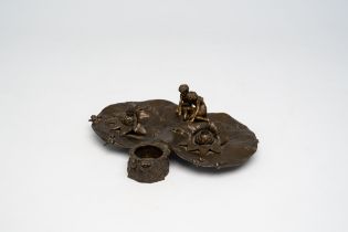 A French bronze Art Nouveau ink well with two children near a pond, ca. 1900