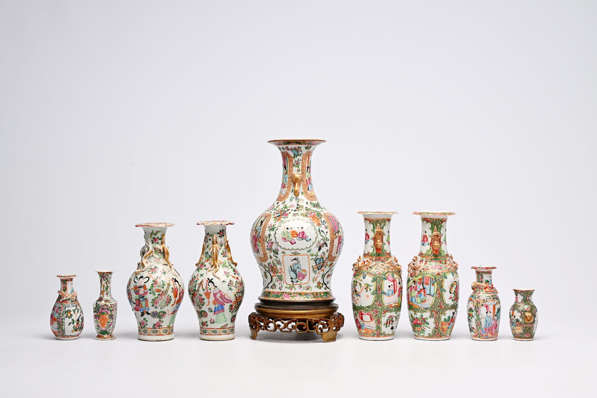 A varied collection of nine Chinese Canton famille rose vases, including two pairs, 19th C. - Image 6 of 8