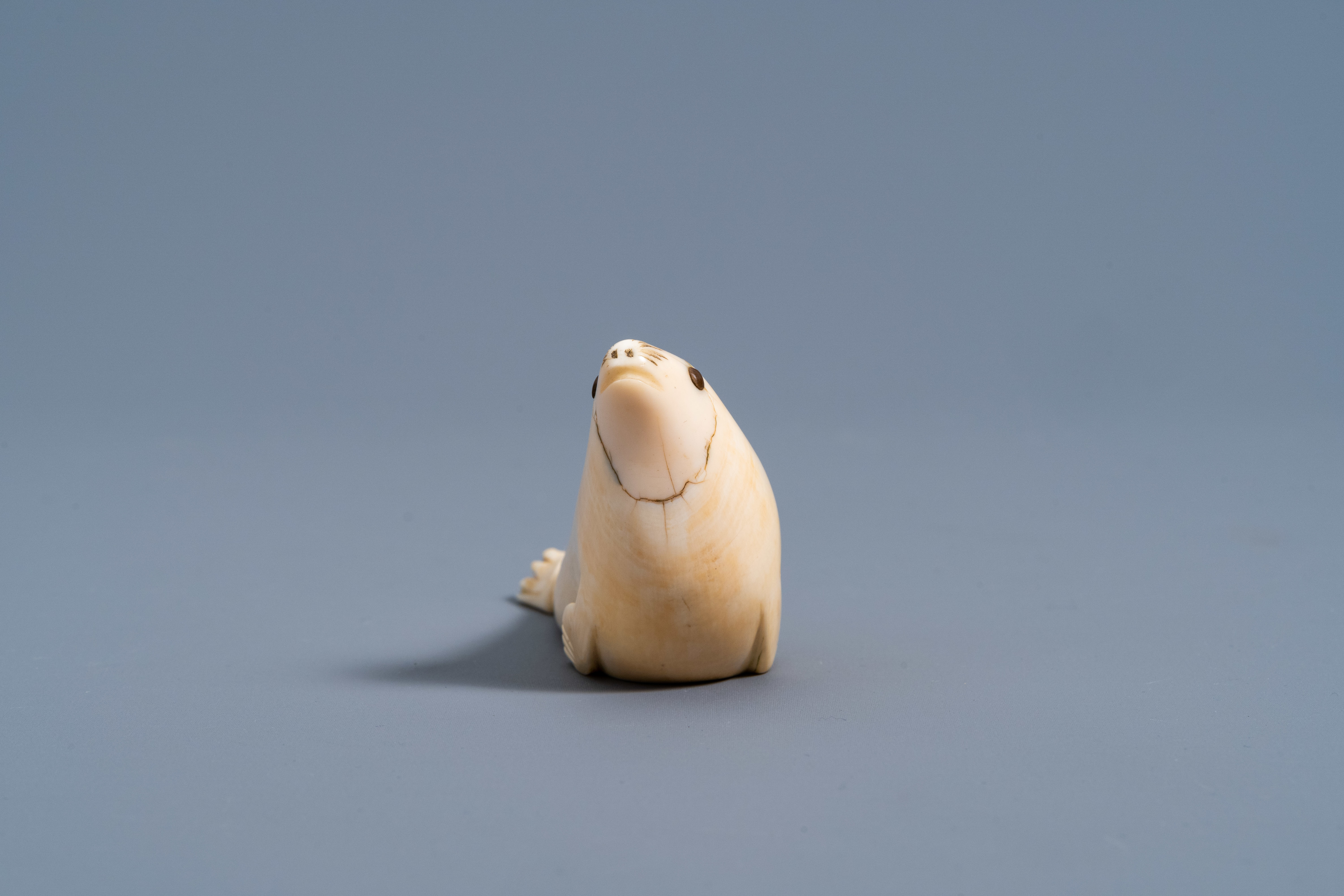 An Inuit carved whale ivory figure of a seal, Canada or Alaska, 19th C. - Image 4 of 11