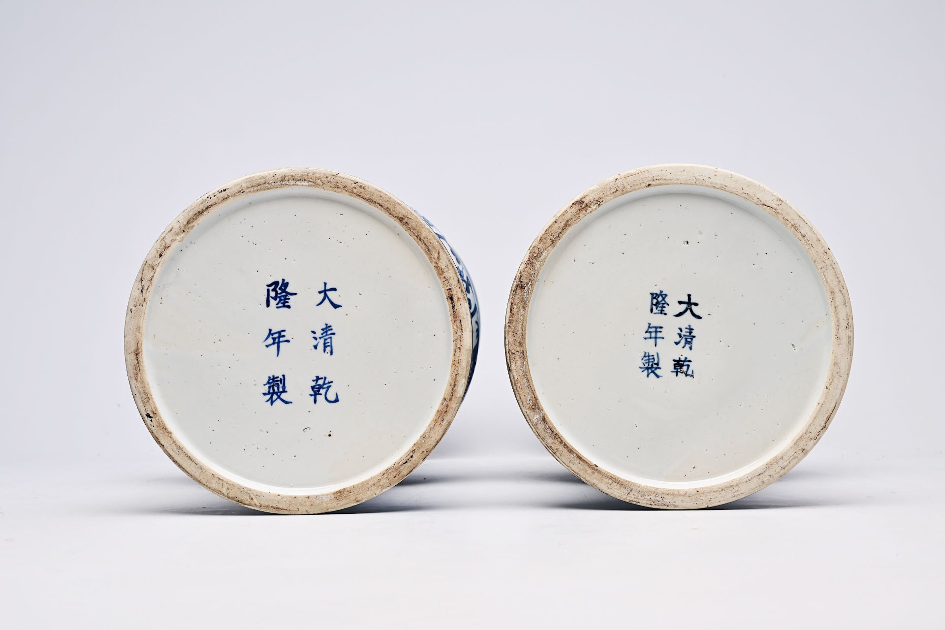 A pair of Chinese blue and white 'gu' vases with dragons and floral design, Qianlong mark, Republic, - Image 19 of 22