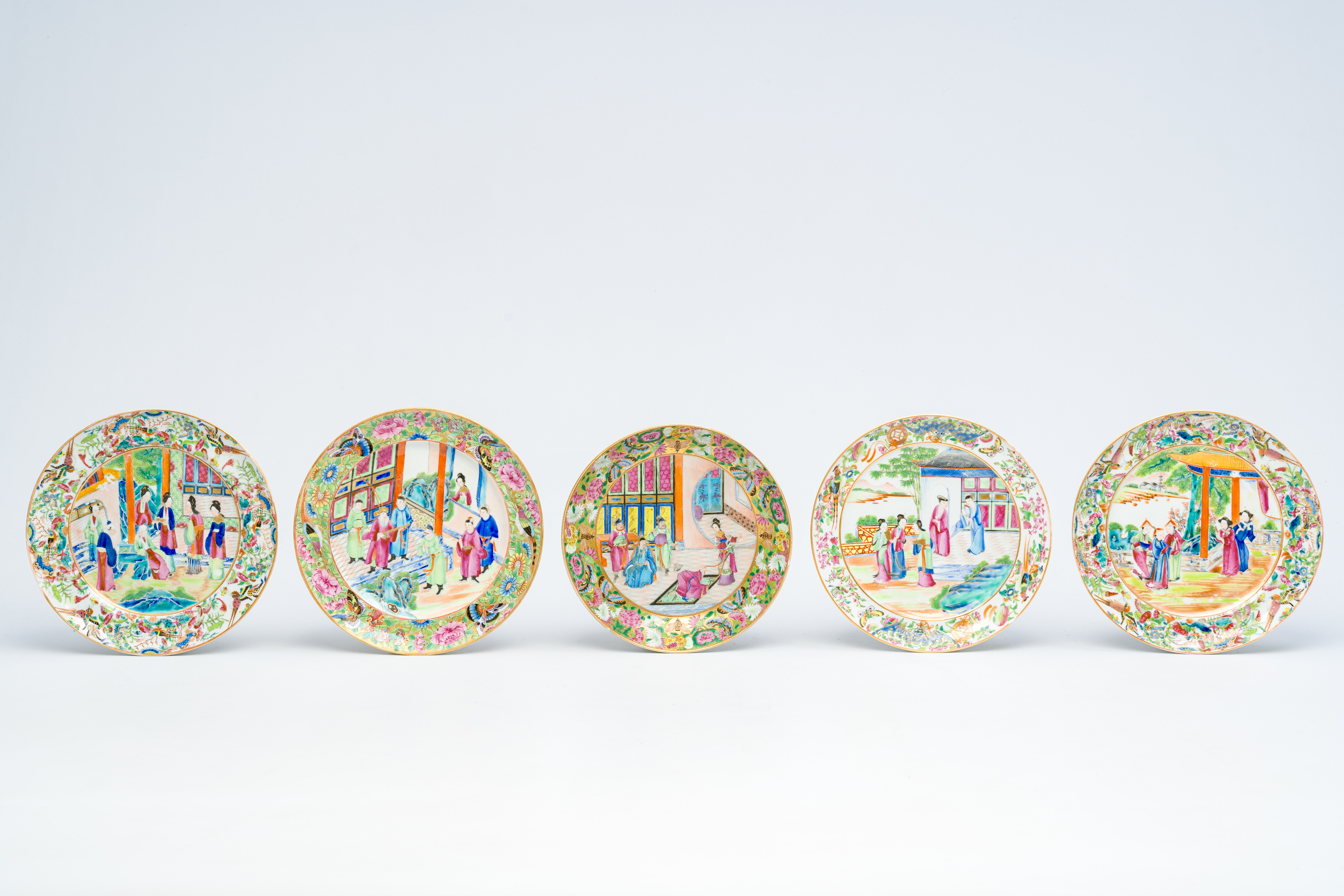 Five Chinese Canton famille rose 'palace scene' plates, 19th C.