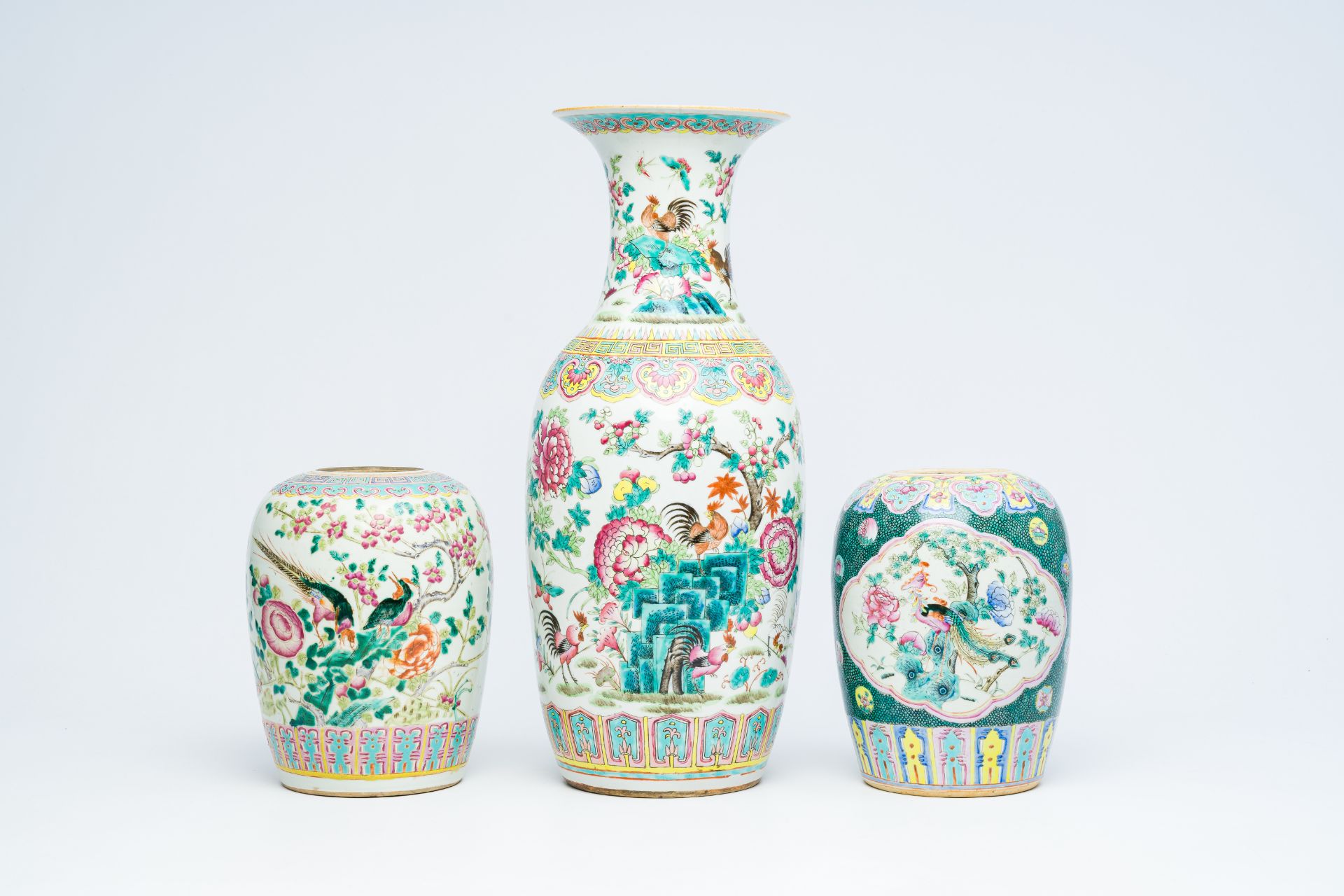 A Chinese famille rose vase and two ginger jars with birds among blossoming branches, 19th C.