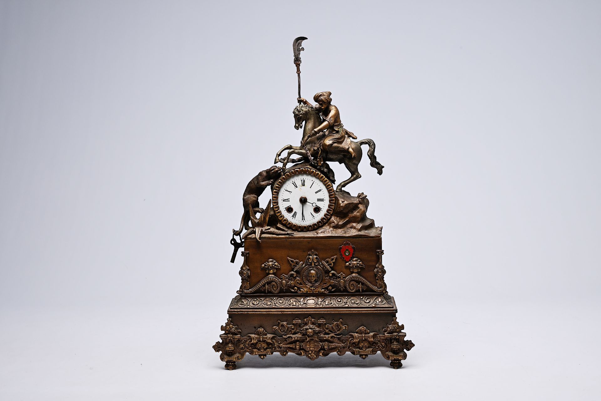 A German partly bronze mantel clock crowned with a Moorish rider on horseback, 19th/20th C.