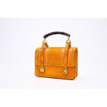 An Italian ochre yellow Alcantara Gucci handbag, 20th C.