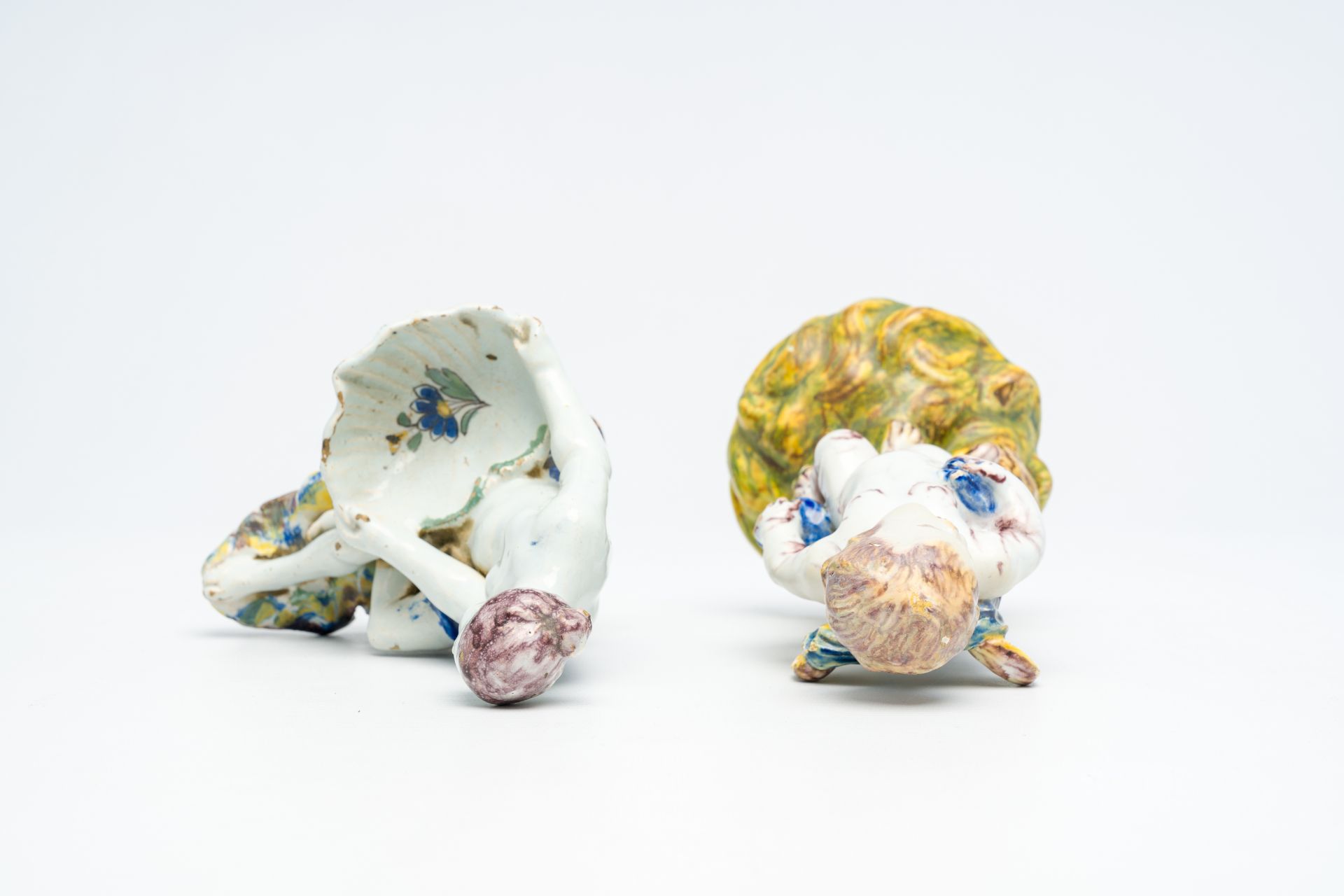 A polychrome 'putto and bird' faience sculpture and a 'lady with a shell' salt cellar, Delft or Brus - Image 6 of 7