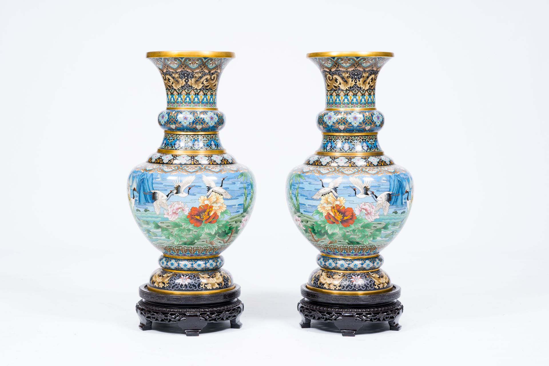 A pair of large Chinese cloisonne 'cranes' vases, 20th C.