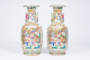 A pair of large ribbed Chinese Canton famille rose vases with palace scenes and the Hehe Er Xian twi