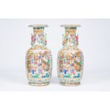 A pair of large ribbed Chinese Canton famille rose vases with palace scenes and the Hehe Er Xian twi