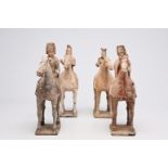 Four Chinese polychrome painted pottery equestrian figures, Tang