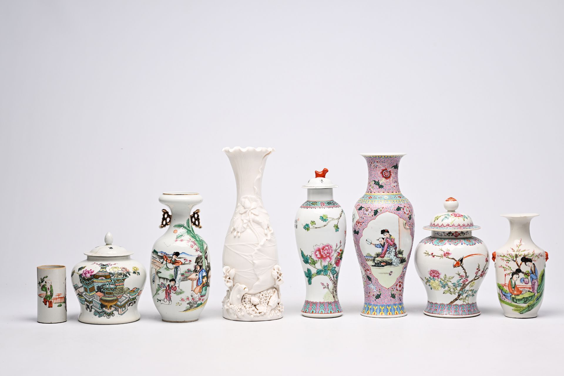Five various Chinese famille rose and blanc de Chine vases, two jars and covers and a brush pot with