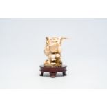 A Japanese ivory 'Happy Bouddha' okimono, signed, Meiji, late 19th C.