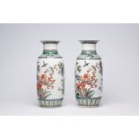 A pair of Chinese famille verte vases with birds among blossoming branches, 20th C.