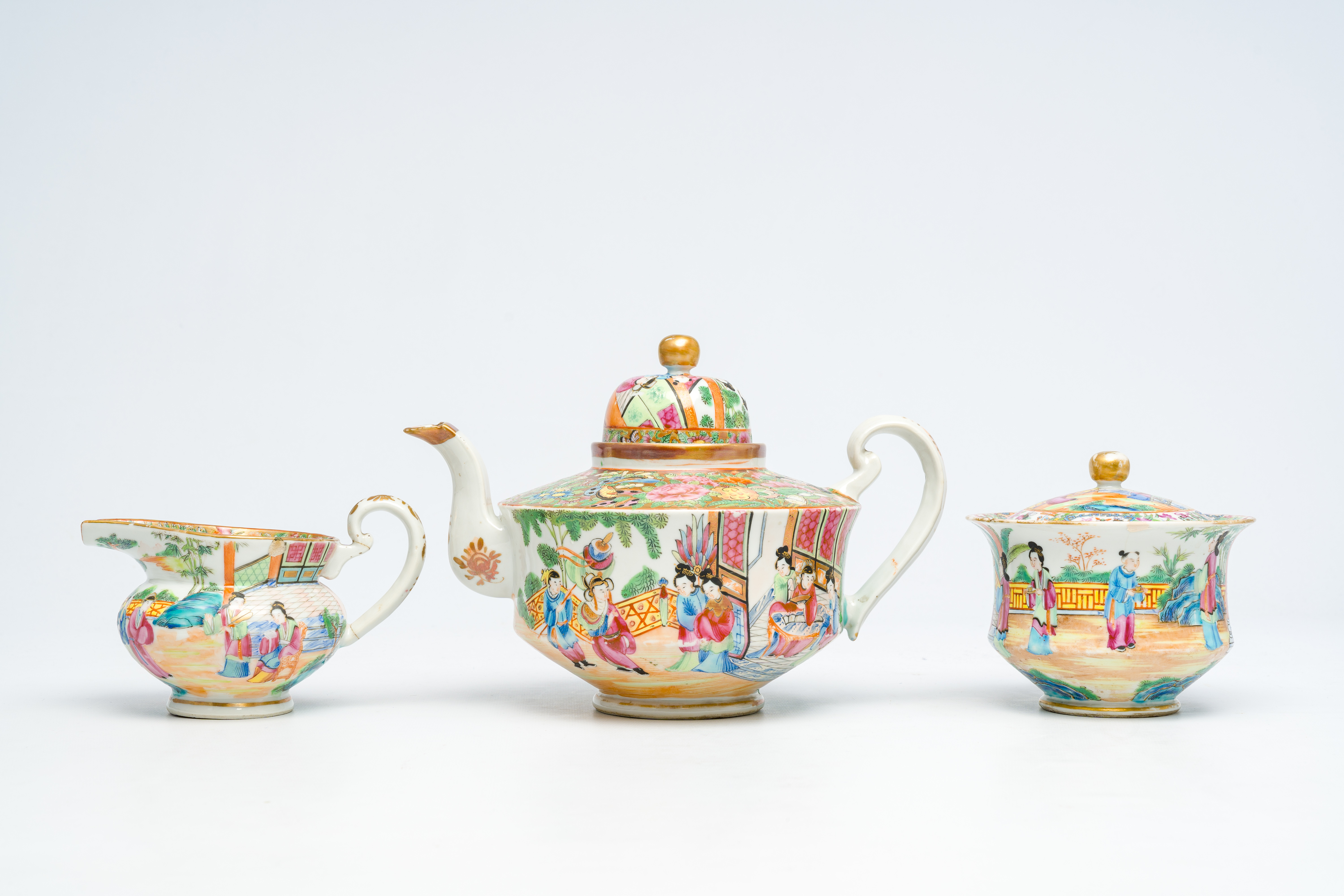 A Chinese Canton famille rose three-part tea set with palace scenes, 19th C. - Image 2 of 7
