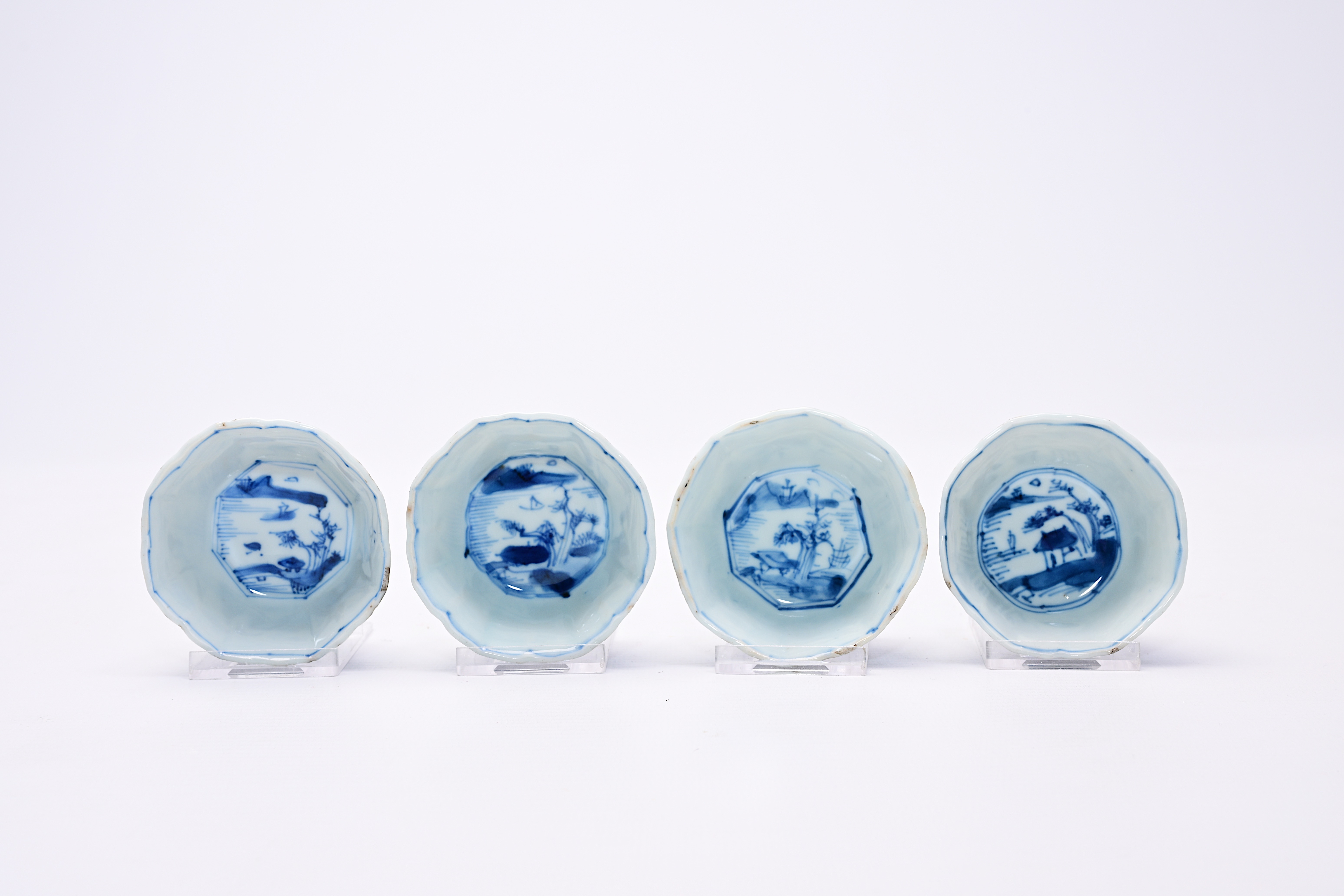 Four Chinese blue and white cups and saucers with floral design and landscapes, Kangxi - Image 6 of 12